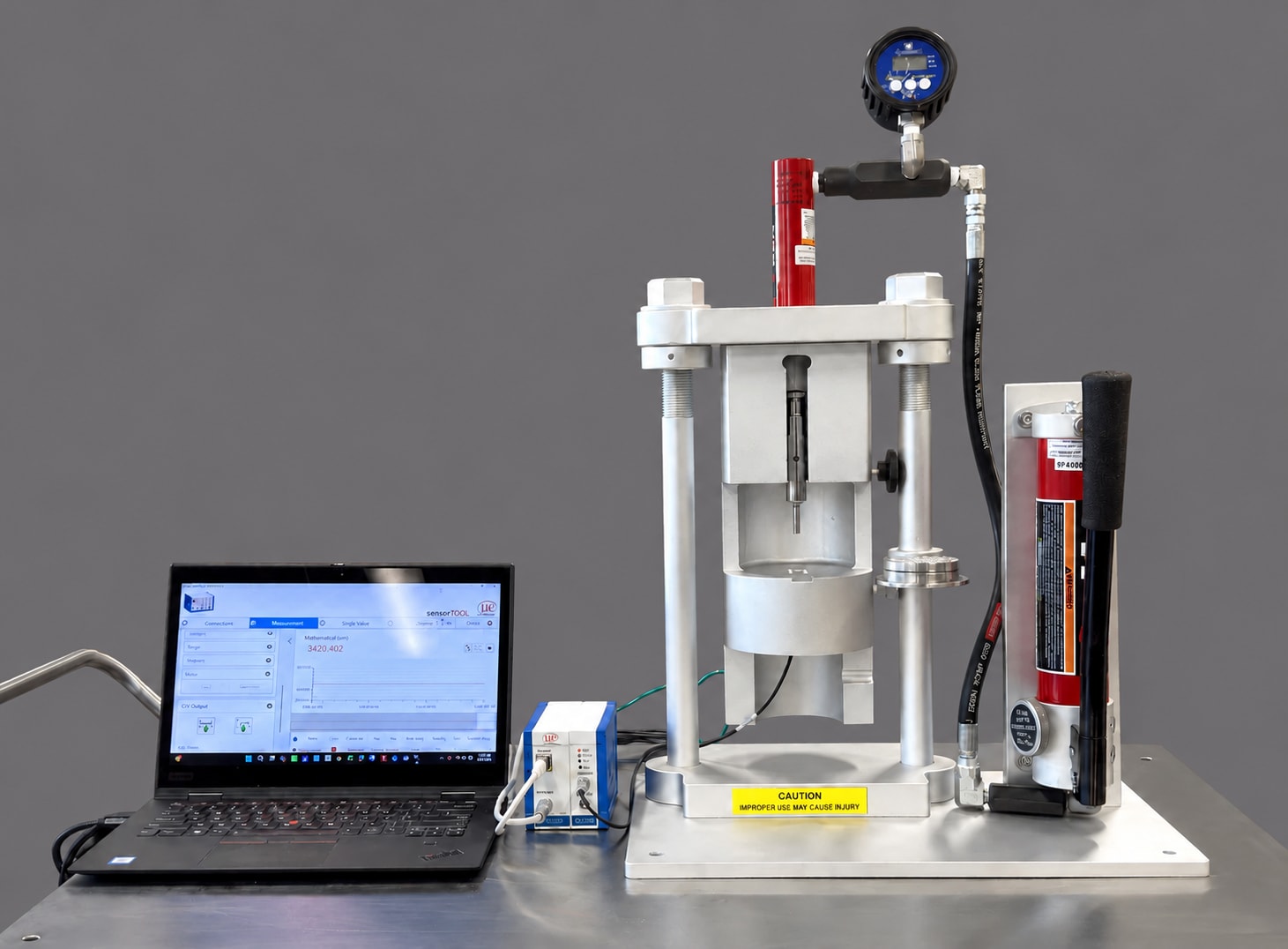 ADHESION IQ™ powder adhesion tester with its laptop software