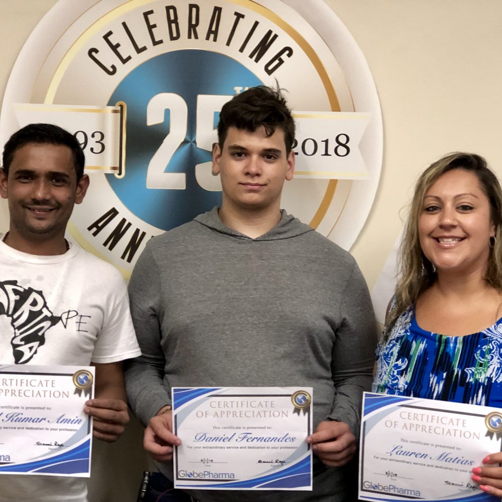 GlobePharma Employees with certificates.